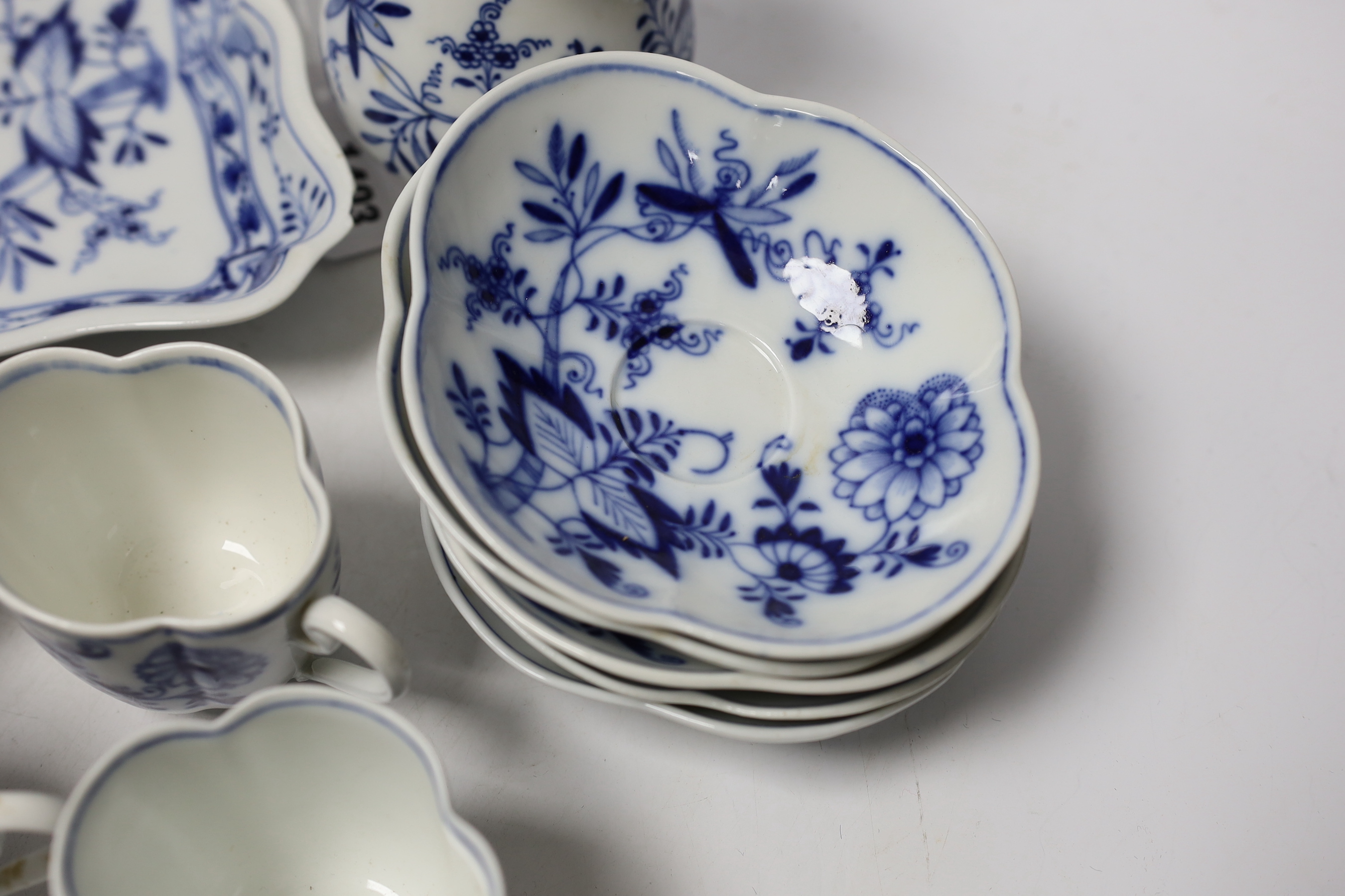Fourteen Meissen items including a coffee pot, five cups and saucers, a square dish and oval dish, and a posy vase, coffee pot 16cm